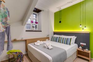 Postel nebo postele na pokoji v ubytování Harismari Cozy Hotel