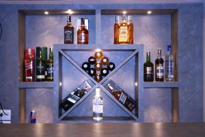 a bar with bottles of alcohol on a wall at Hotel Samrajya Pvt. Ltd. in Kathmandu