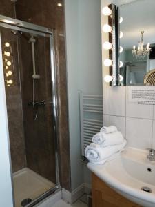 a bathroom with a shower and a sink at The Pier in Portsmouth +11 photos
