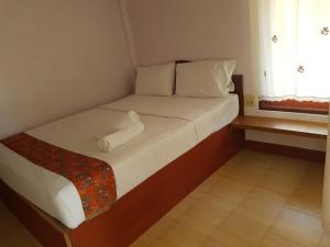 Tempat tidur dalam kamar di Phuphat Beach