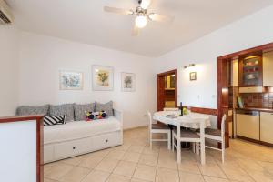 a living room with a bed and a table at Holiday Apartment Magnolia in Zadar