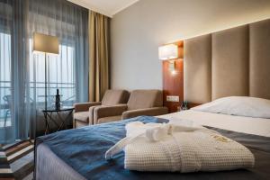 Postel nebo postele na pokoji v ubytování Hotel Belweder