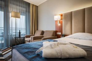 
Łóżko lub łóżka w pokoju w obiekcie Hotel Belweder
