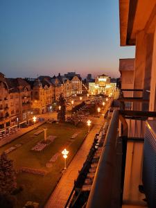 a view of a city at night with street lights at Central View Apartment in Timişoara