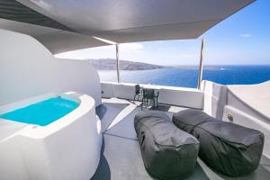 a hot tub on the back of a boat at Theodora Suites in Oia