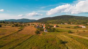 an aerial view of a farm in a field at House Malkoc in Saborsko