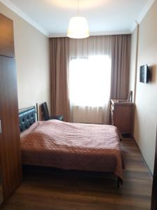 Кровать или кровати в номере Apartment Gorgiladze 66