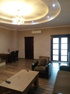 a living room with a couch and a table at Apartment Gorgiladze 66 in Batumi
