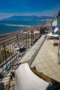 a balcony with a skateboard on the beach at On the beach Sea-view&Kitchen In Room in Salerno