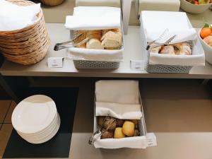 a shelf with two boxes of bread and other foods at Hotel Mediteran in Zadar
