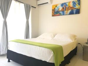 Postel nebo postele na pokoji v ubytování Hotel Balcones de Bocagrande