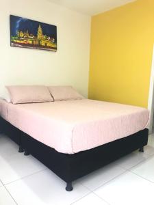 Postel nebo postele na pokoji v ubytování Hotel Balcones de Bocagrande