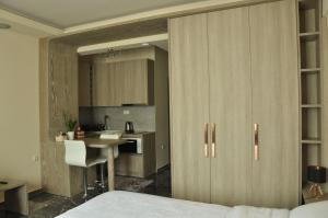 A kitchen or kitchenette at Agias Sofias Street Luxurious Studio