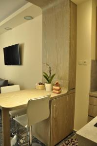 A television and/or entertainment centre at Agias Sofias Street Luxurious Studio