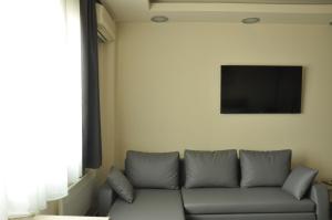 A television and/or entertainment centre at Agias Sofias Street Luxurious Studio
