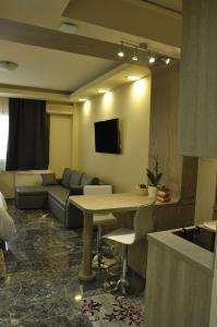 A television and/or entertainment centre at Agias Sofias Street Luxurious Studio