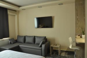 A television and/or entertainment centre at Agias Sofias Street Luxurious Studio