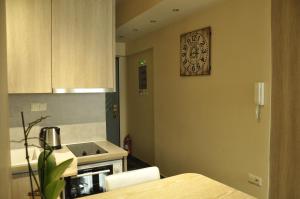 A bed or beds in a room at Agias Sofias Street Luxurious Studio