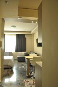 A television and/or entertainment centre at Agias Sofias Street Luxurious Studio