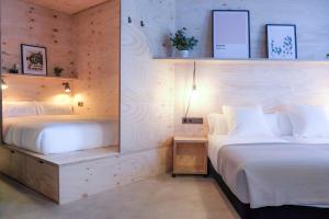 Talo Urban Rooms客房内的一张或多张床位