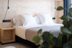 Talo Urban Rooms客房内的一张或多张床位