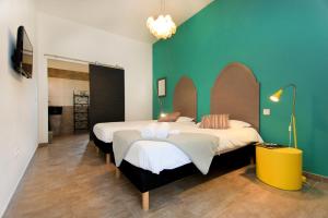Postel nebo postele na pokoji v ubytování Hôtel Ascosa Aventure