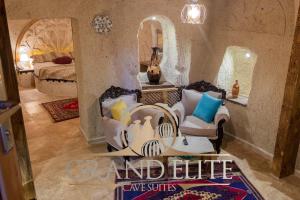 a living room filled with furniture and a large mirror at Grand Elite Cave Suites in Goreme