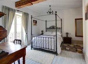 Katil atau katil-katil dalam bilik di Appartements du Vin