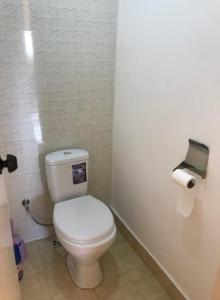 a bathroom with a white toilet in a stall at NUR Apartment in Goris in Goris