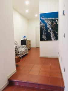 a living room with a painting on the wall and a couch at Residenza Giulietta in Rimini