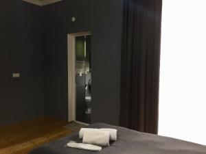 Ένα ή περισσότερα κρεβάτια σε δωμάτιο στο Guest House Maradona