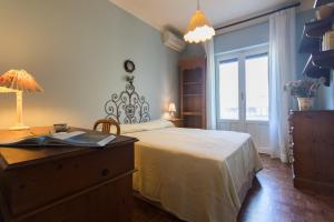 Ένα ή περισσότερα κρεβάτια σε δωμάτιο στο Villa Gabriella - Mondello