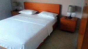 Postel nebo postele na pokoji v ubytování Hotel Majestic