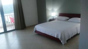 Postel nebo postele na pokoji v ubytování Hotel Majestic