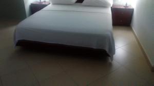 Postel nebo postele na pokoji v ubytování Hotel Majestic