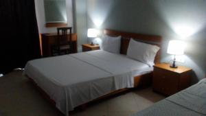 Postel nebo postele na pokoji v ubytování Hotel Majestic