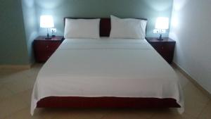 Postel nebo postele na pokoji v ubytování Hotel Majestic
