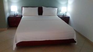 Postel nebo postele na pokoji v ubytování Hotel Majestic