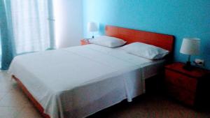 Postel nebo postele na pokoji v ubytování Hotel Majestic