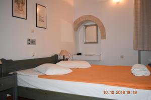 Postel nebo postele na pokoji v ubytování Vecchio Hotel