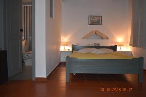 Postel nebo postele na pokoji v ubytování Vecchio Hotel