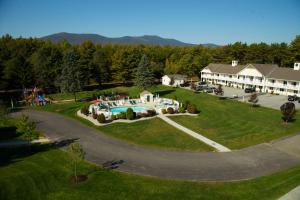 an aerial view of a house with a swimming pool at Golden Gables Inn in North Conway