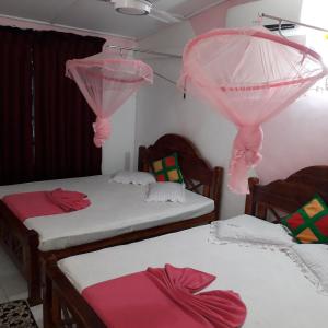 Voodi või voodid majutusasutuse Dilshan Guest toas
