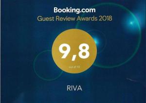a sign that says guest review awards with a yellow circle at Riva in Krapanj