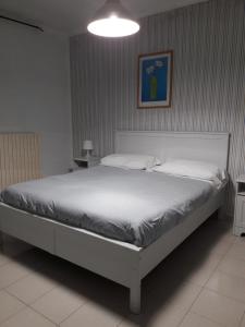 Ένα ή περισσότερα κρεβάτια σε δωμάτιο στο B&B La Villa
