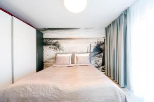 Postel nebo postele na pokoji v ubytování Przytulne i Nowoczesne Apartamenty Sun Seasons 24 w Dziwnowie z Parkingiem by Noclegi Renters + 16 fotografií