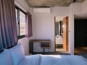 Postel nebo postele na pokoji v ubytování Doudian DDiNN Hotel + 37 fotografií