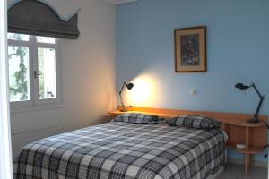 Säng eller sängar i ett rum på Priamos Kalitehnoupoli