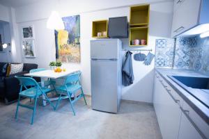 Kuchyň nebo kuchyňský kout v ubytování Cozy Suite Kallithea