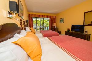 Ein Bett oder Betten in einem Zimmer der Unterkunft Hotel Bakoua Martinique